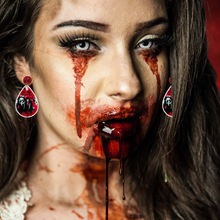 Load image into Gallery viewer, A bloody zombie model wearing earrings featuring Ghostface from Scream on the phone with a bloodstained background and the phrase &#39;No You Hang Up First,&#39; perfect for fans of the cult classic horror movie
