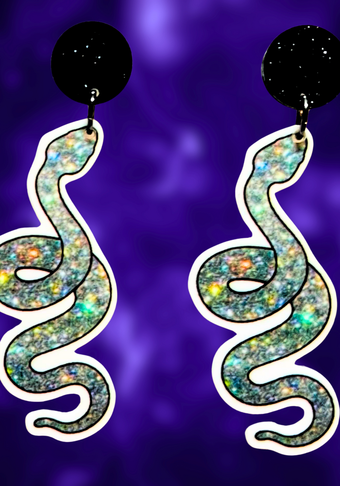 A pair of sparkly silver snake earrings, perfect for adding a glamorous and mystical touch to your Halloween fashion.