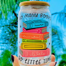 Load image into Gallery viewer, A 16oz BPA-free glass cup with a UVDTF wrap featuring colorful stacked books and the phrase &quot;So Many Books, So Little Time.&quot; Includes a bamboo lid and reusable glass straw, perfect for book lovers and cold drinks.
