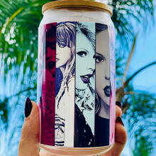 Load image into Gallery viewer, A 16oz BPA-free glass cup with a UVDTF wrap featuring Taylor Swift&#39;s iconic eras, complete with a bamboo lid and reusable glass straw. Perfect for Swifties and cold drinks.
