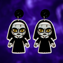 Load image into Gallery viewer, Cute cartoon nun earrings inspired by The Conjuring universe, ideal for fans of horror movies and fun Halloween accessories.
