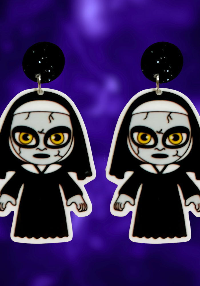 Cute cartoon nun earrings inspired by The Conjuring universe, ideal for fans of horror movies and fun Halloween accessories.