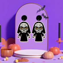 Load image into Gallery viewer, Cute cartoon nun earrings inspired by The Conjuring universe, ideal for fans of horror movies and fun Halloween accessories.
