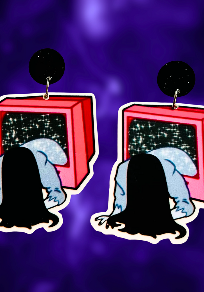 Earrings featuring a cartoon-style figure climbing out of a TV, inspired by The Ring, perfect for fans of horror movies and unique Halloween accessories.