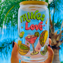 Load image into Gallery viewer, A 20oz BPA-free glass cup with a colorful UVDTF wrap featuring tacos, margaritas, guacamole, and lime wedges. Complete with a bamboo lid and reusable glass straw, perfect for happy hour lovers.
🌮🍹
