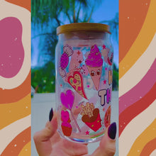 Load and play video in Gallery viewer, A 16oz BPA-free glass cup featuring a colorful UVDTF wrap with Disney-inspired snacks, including churros, Mickey pretzels, and ice cream. Comes with a bamboo lid and reusable glass straw, perfect for Disney and snack lovers.
