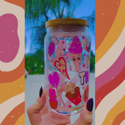 A 16oz BPA-free glass cup featuring a colorful UVDTF wrap with Disney-inspired snacks, including churros, Mickey pretzels, and ice cream. Comes with a bamboo lid and reusable glass straw, perfect for Disney and snack lovers.