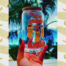 Load and play video in Gallery viewer, A 16 oz glass cup featuring a cute tamale-themed UVDTF wrap with the phrase “’Tis the Season for Tamales.” Includes a bamboo lid and reusable glass straw, perfect for cold drinks. BPA-free and handwash only.
